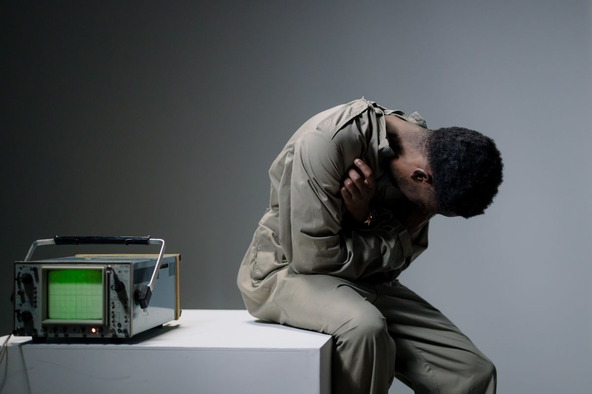 Person sitting in quiet despair — representing depression