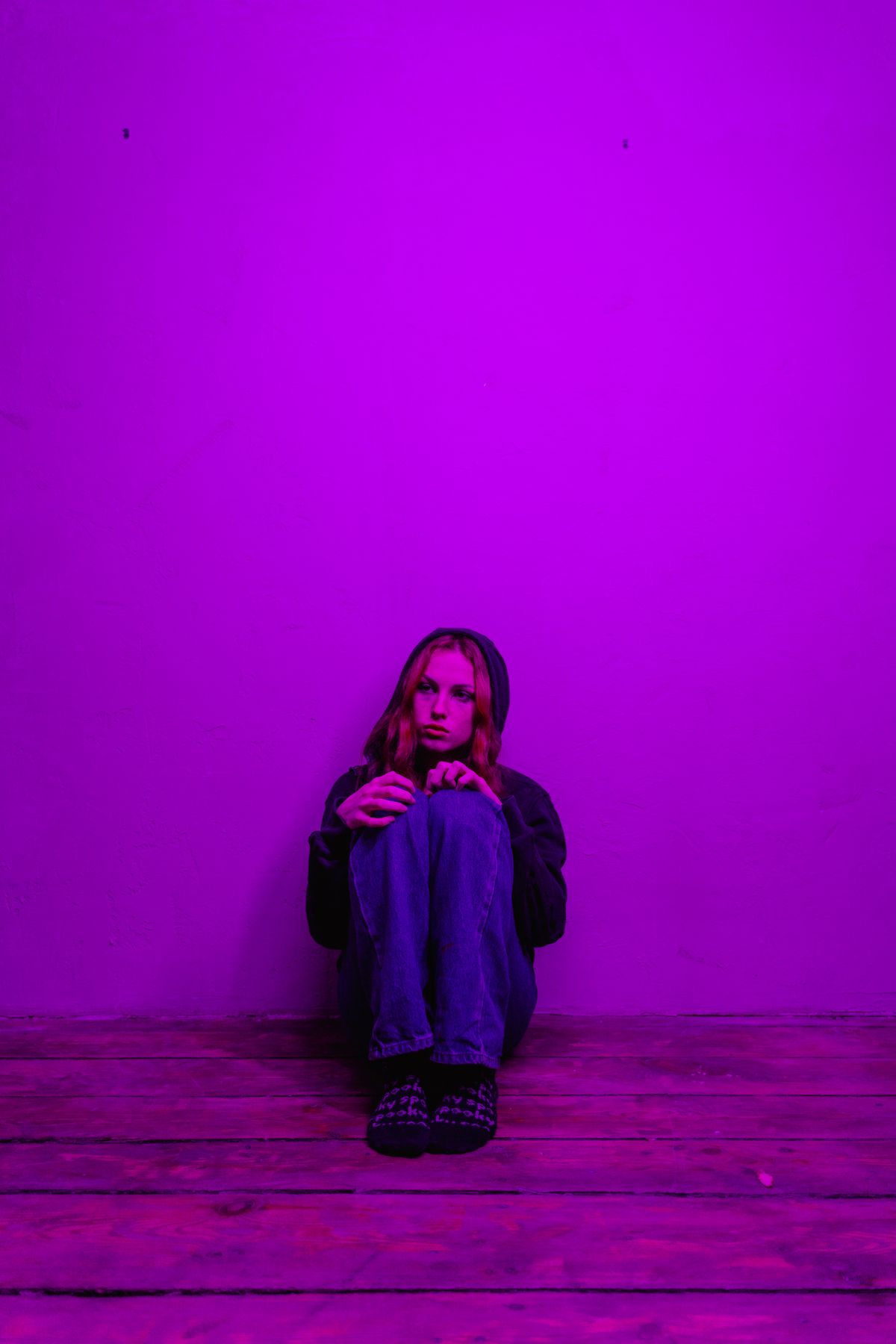 Woman reflecting in a quiet room — representing trauma